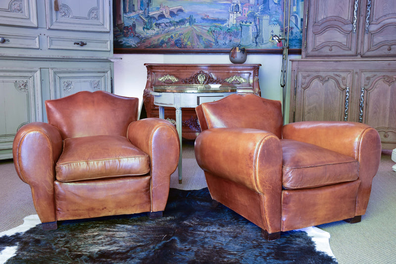 Pair of 1950's moustache back leather club chairs
