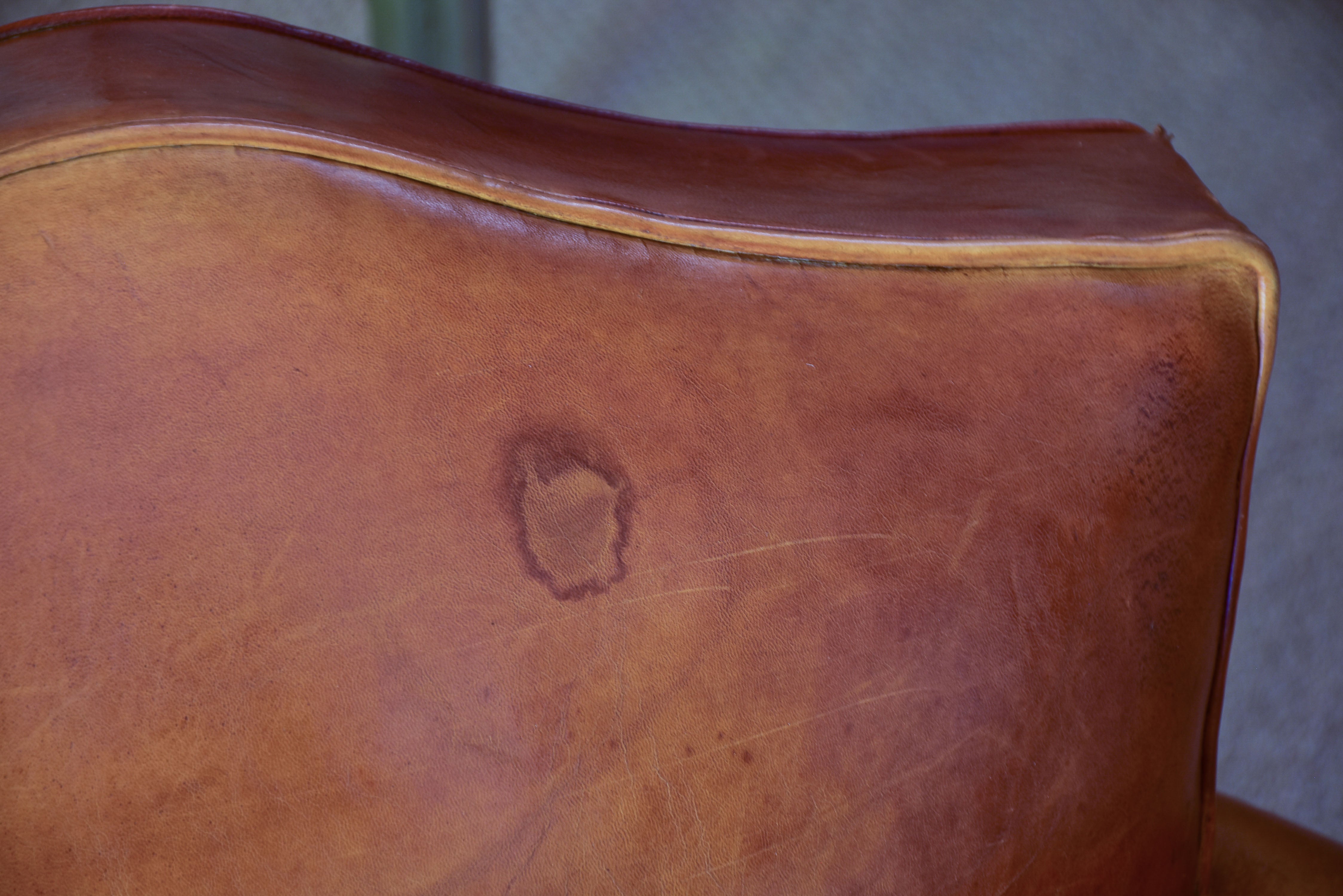 Pair of 1950's moustache back leather club chairs