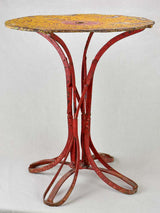 Early twentieth century bistro garden table with yellow and red patina