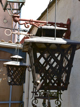 Pair of French wrought iron lanterns with wall brackets