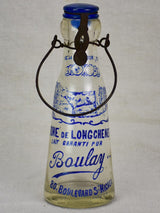 Antique French glass milk bottle with blue decoration