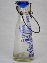 Antique French glass milk bottle with blue decoration