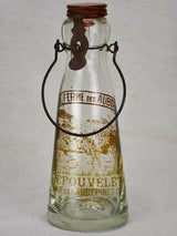 Antique French glass milk bottle with brown decoration