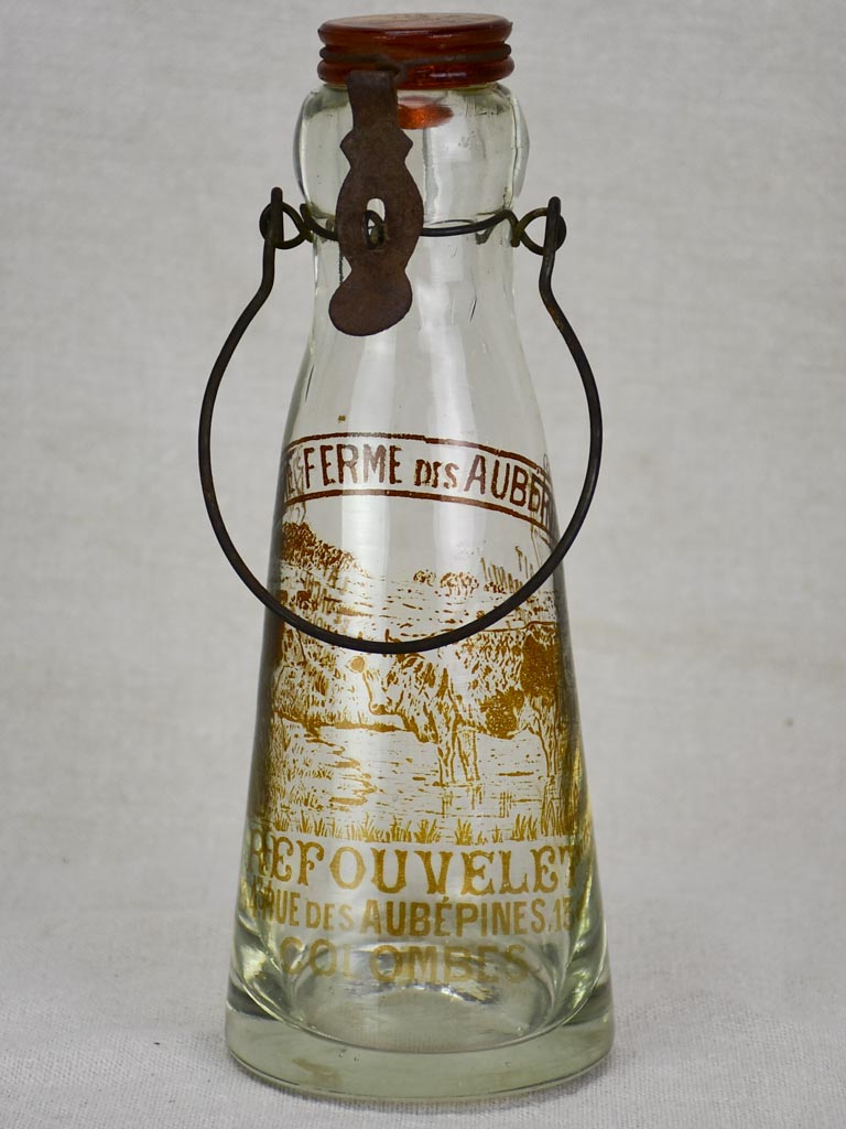 Antique French glass milk bottle with brown decoration