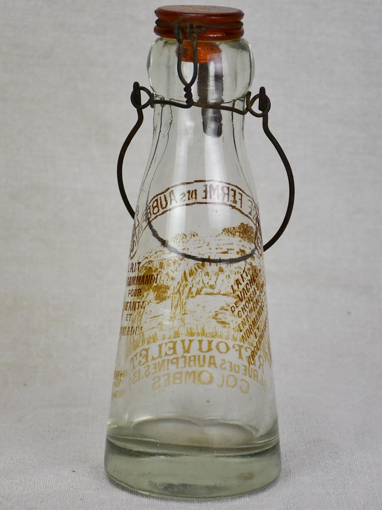 Antique French glass milk bottle with brown decoration
