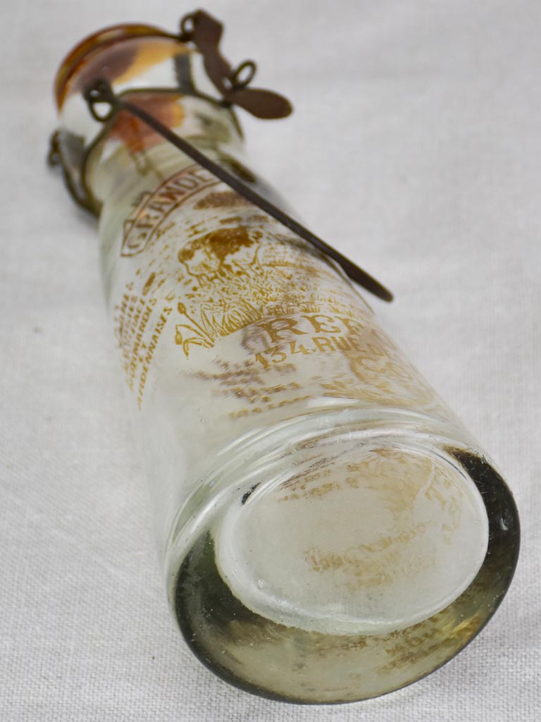 Antique French glass milk bottle with brown decoration