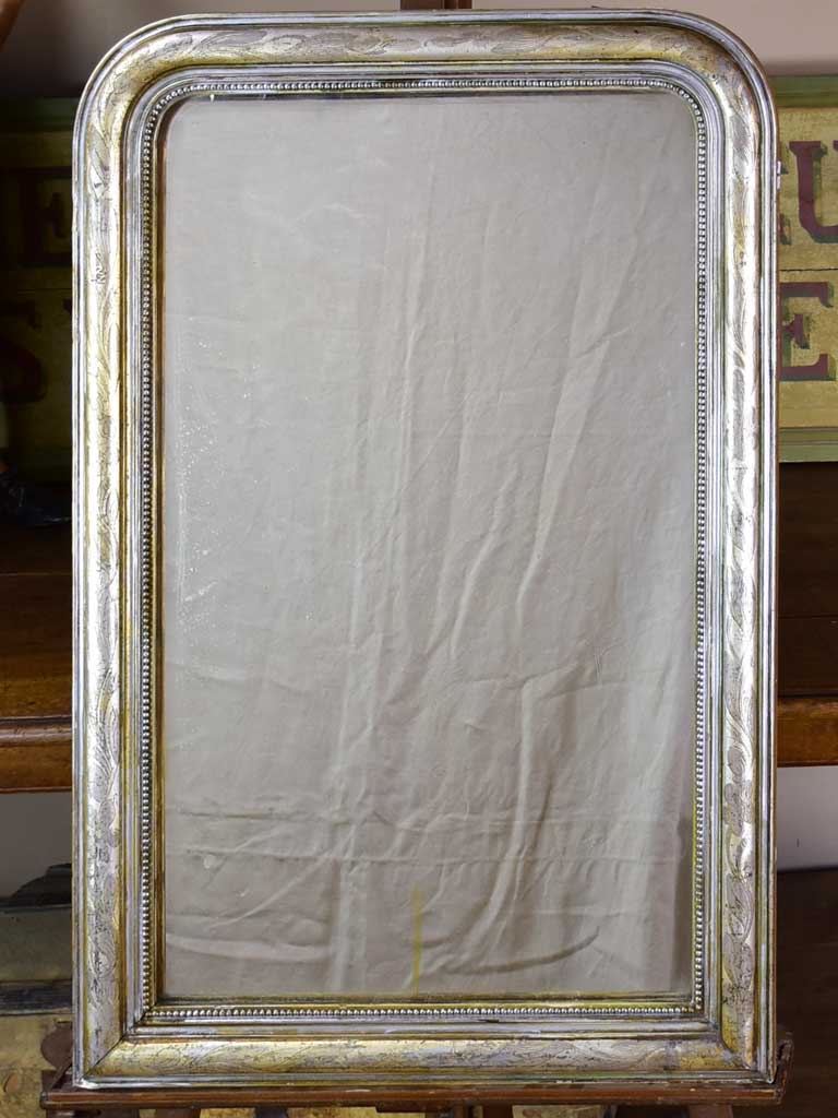19th century Louis Philippe mirror with silver leaf frame and running pearl 26¾" x 41"