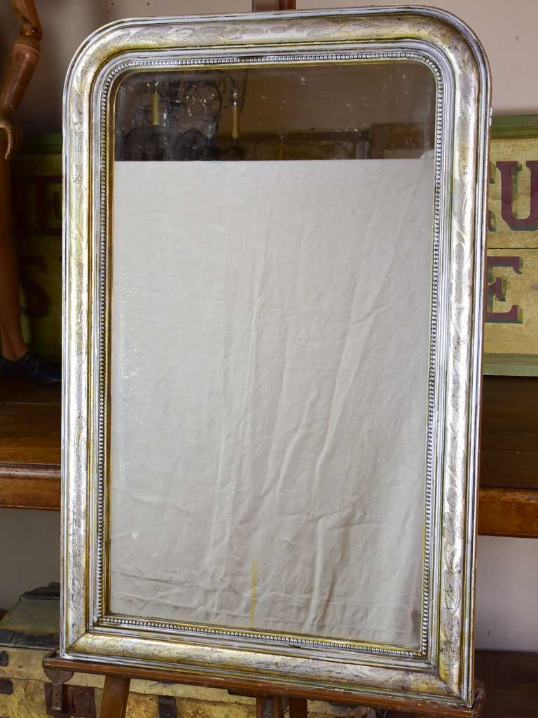 19th century Louis Philippe mirror with silver leaf frame and running pearl 26¾" x 41"