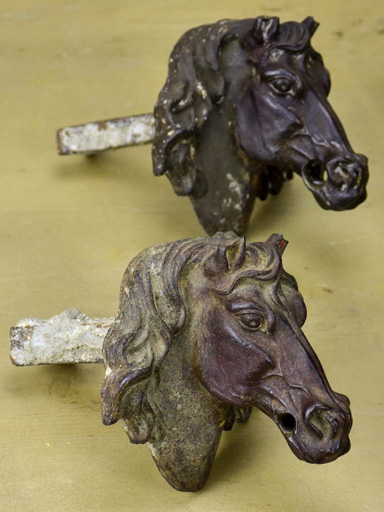 Pair of antique French cast iron horse heads