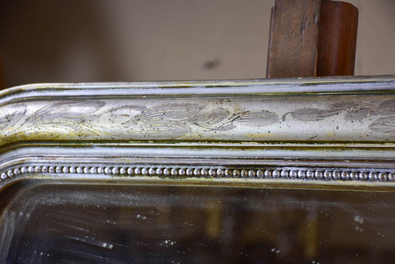 19th century Louis Philippe mirror with silver leaf frame and running pearl 26¾" x 41"
