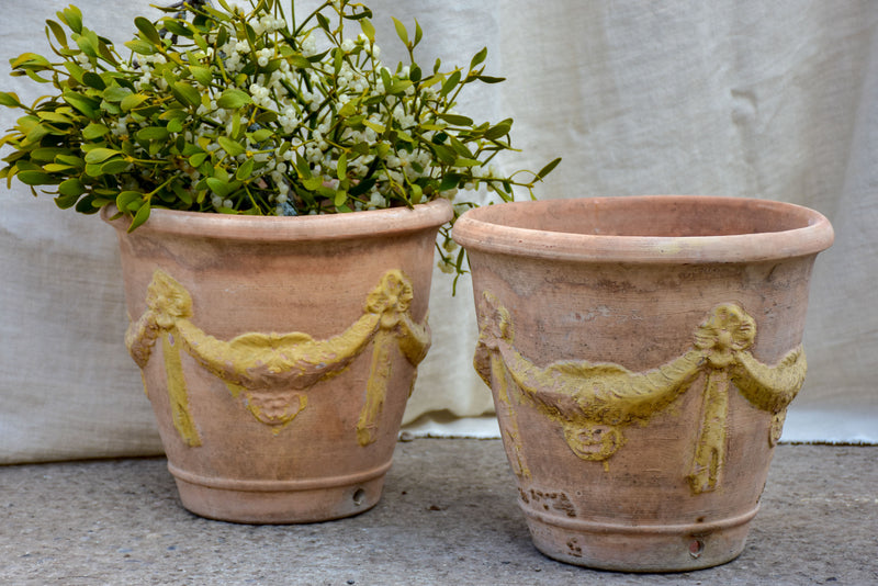 Pair of vintage terracotta garden planters with garlands