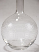 Vintage glass carafe with etched patterns