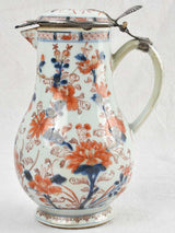 Glimmering gilt highlighted porcelain china pitcher