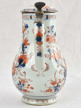 Ancient porcelain pitcher with silver mounts