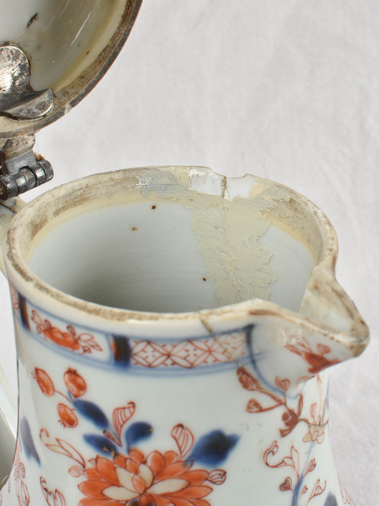 French market porcelain pitcher with crack