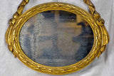 Pair of Louis XVI-style oval mirrors with carved wood frames 22" x 28¾"