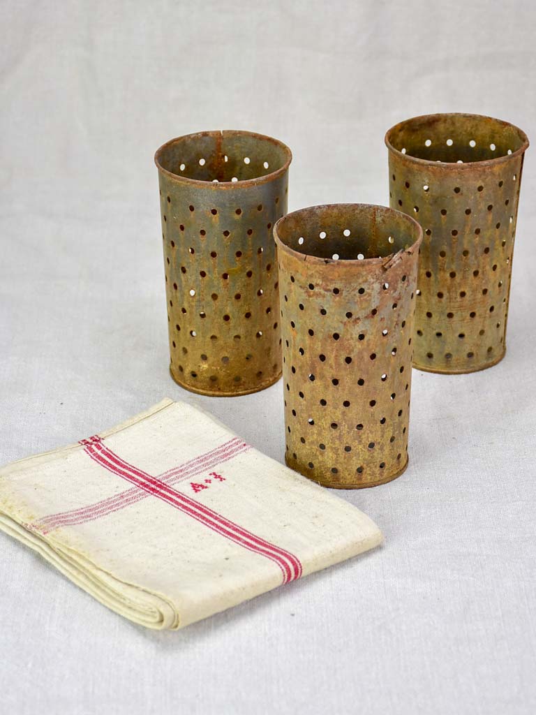 Collection of three tin cheese molds / faisselles