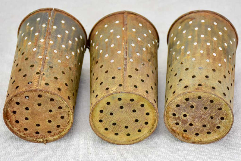 Collection of three tin cheese molds / faisselles