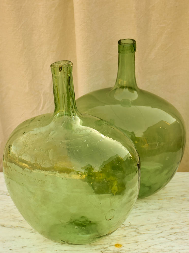 Two antique French demijohn bottles - oval blue green