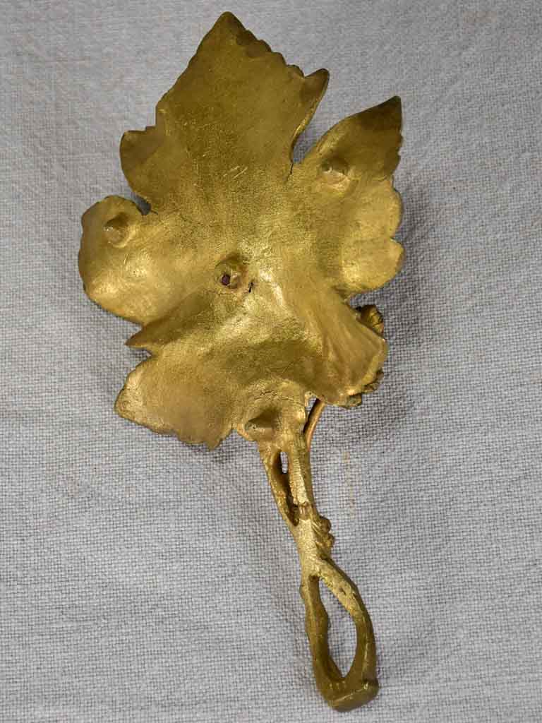 Late 19th-century bronze candleholder in the shape of a vine leaf