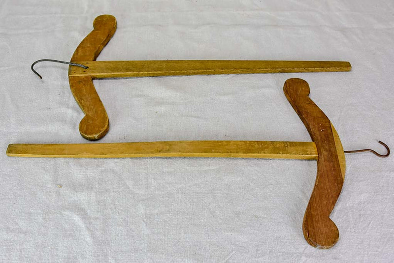 Two antique French coat hangers