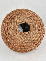 Small demijohn bottle in woven straw basket 11½"