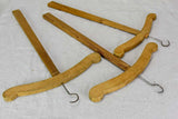 Three antique French coat hangers