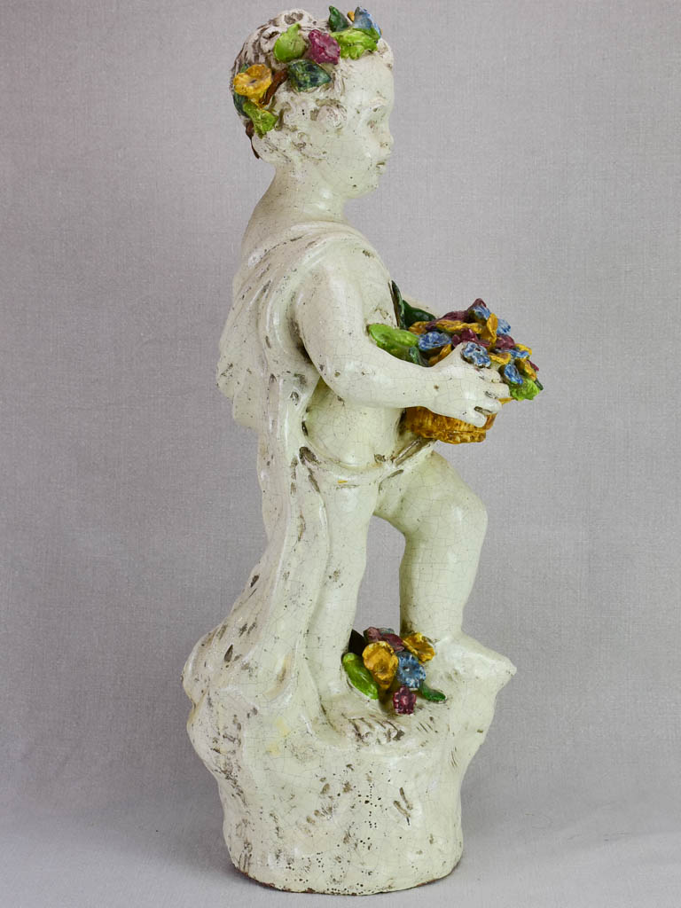 Mid century faience Putto with colorful flowers 26"