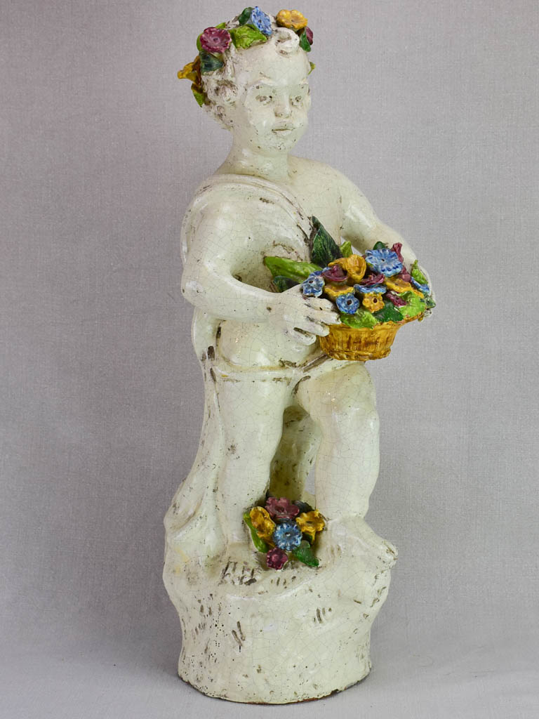 Mid century faience Putto with colorful flowers 26"
