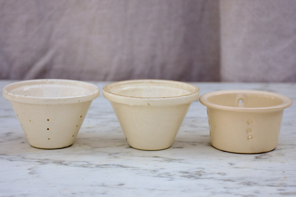 Three white miniature French faience cheese molds