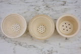 Three white miniature French faience cheese molds