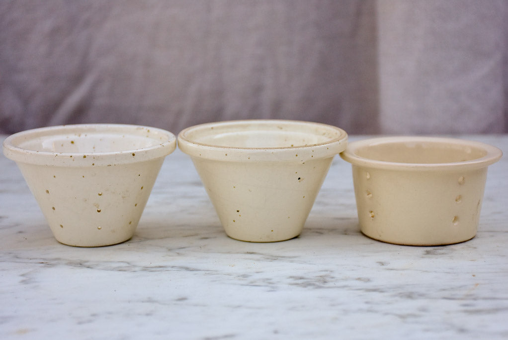 Three white miniature French faience cheese molds
