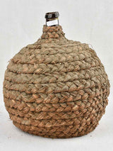 Medium demijohn bottle in woven straw basket 13¾"