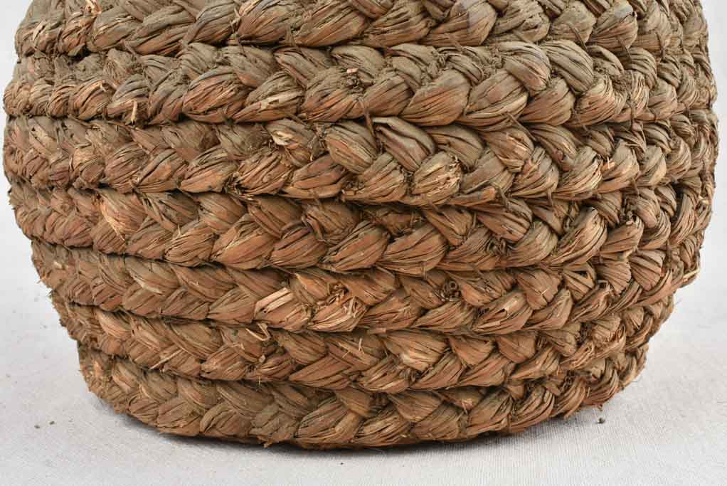 Medium demijohn bottle in woven straw basket 13¾"