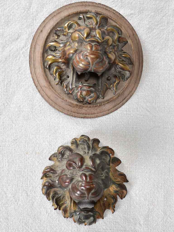 Vintage patinated bronze lions' head accents