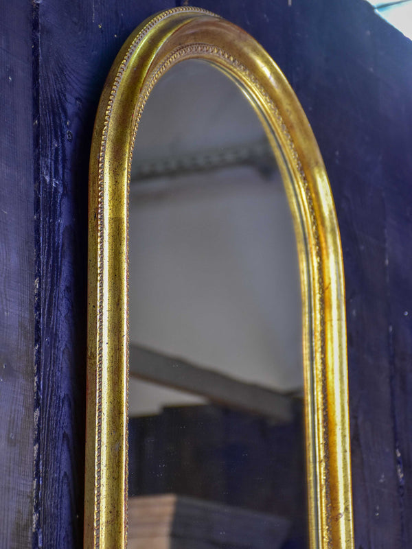 Vintage French arched mirror with gilded frame