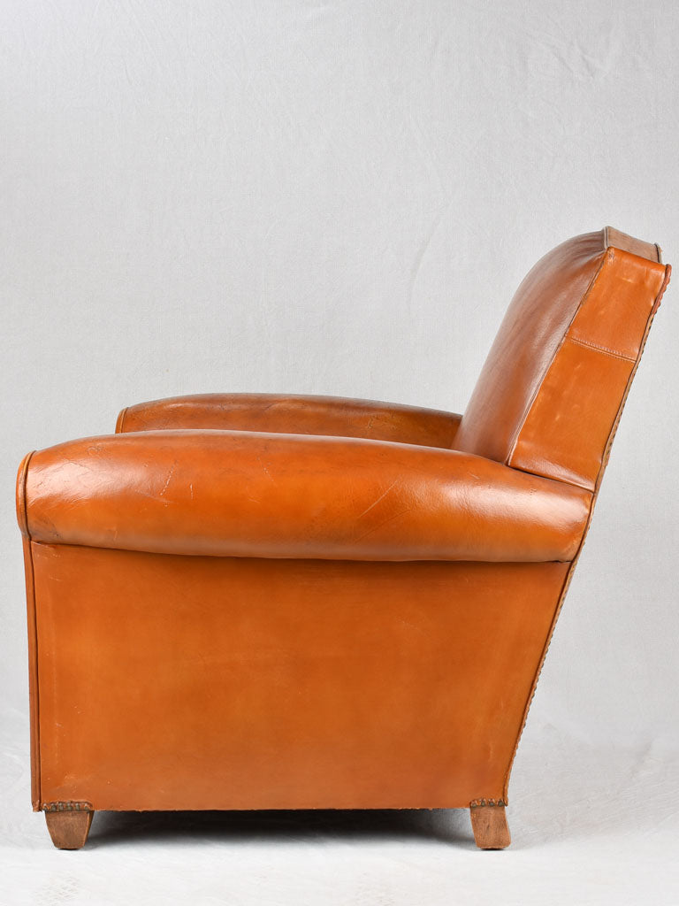 Vintage French leather club chair with chapeau gendarme back