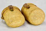 Two mid century French 'verre de cure' glasses in baskets