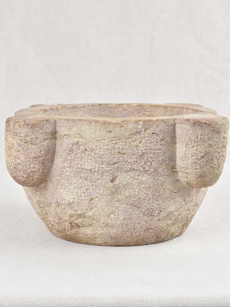 Antique stone mortar with brown / purple patina