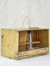 Small 1920's birdcage with nest and water