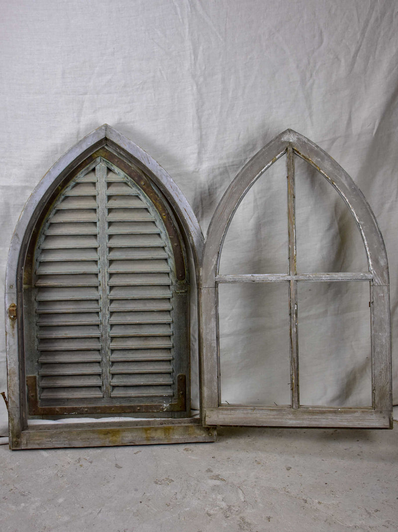 Antique French window with shutters - peaked arch
