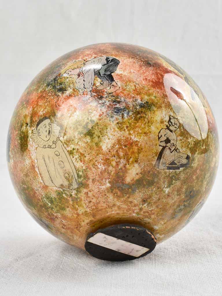 Antique French blown glass wig display decorated with villagers 6"