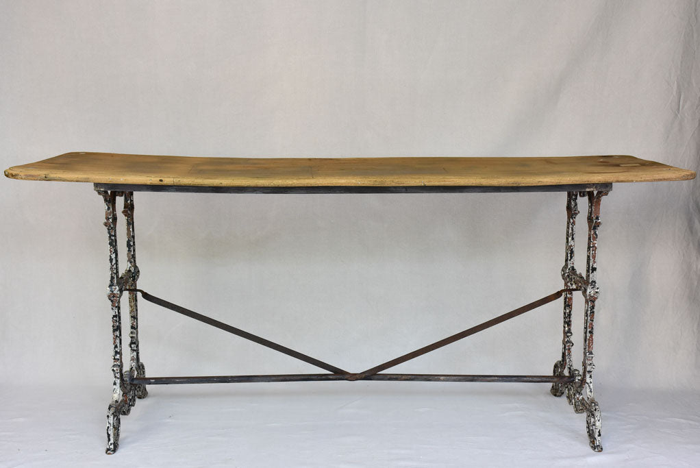 Early twentieth century French bistro table with cast iron base and timber top 66¼"