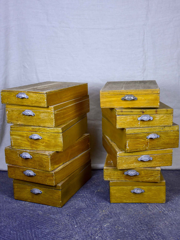 Set of twelve antique French boxes from a glove shop