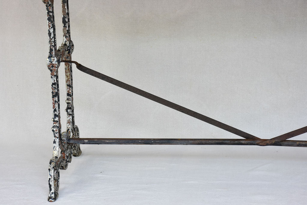 Early twentieth century French bistro table with cast iron base and timber top 66¼"