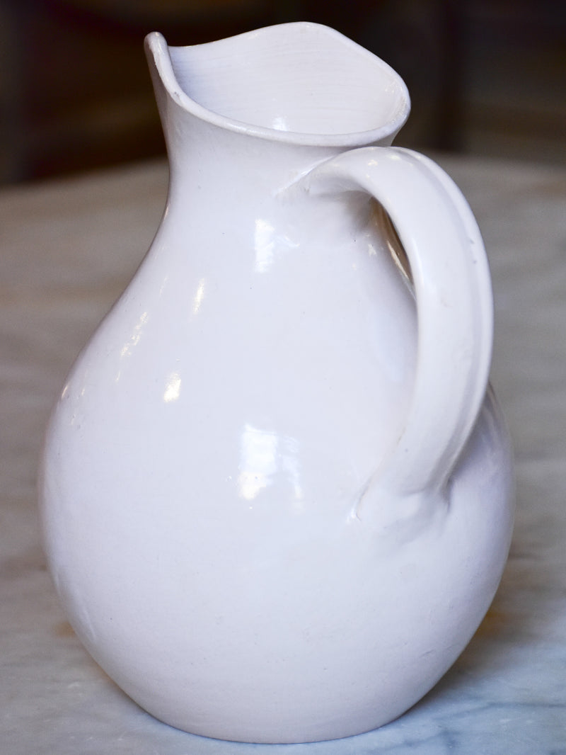 Antique French terracotta pitcher with white glaze
