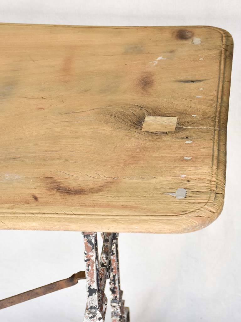 Early twentieth century French bistro table with cast iron base and timber top 66¼"