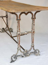 Early twentieth century French bistro table with cast iron base and timber top 66¼"