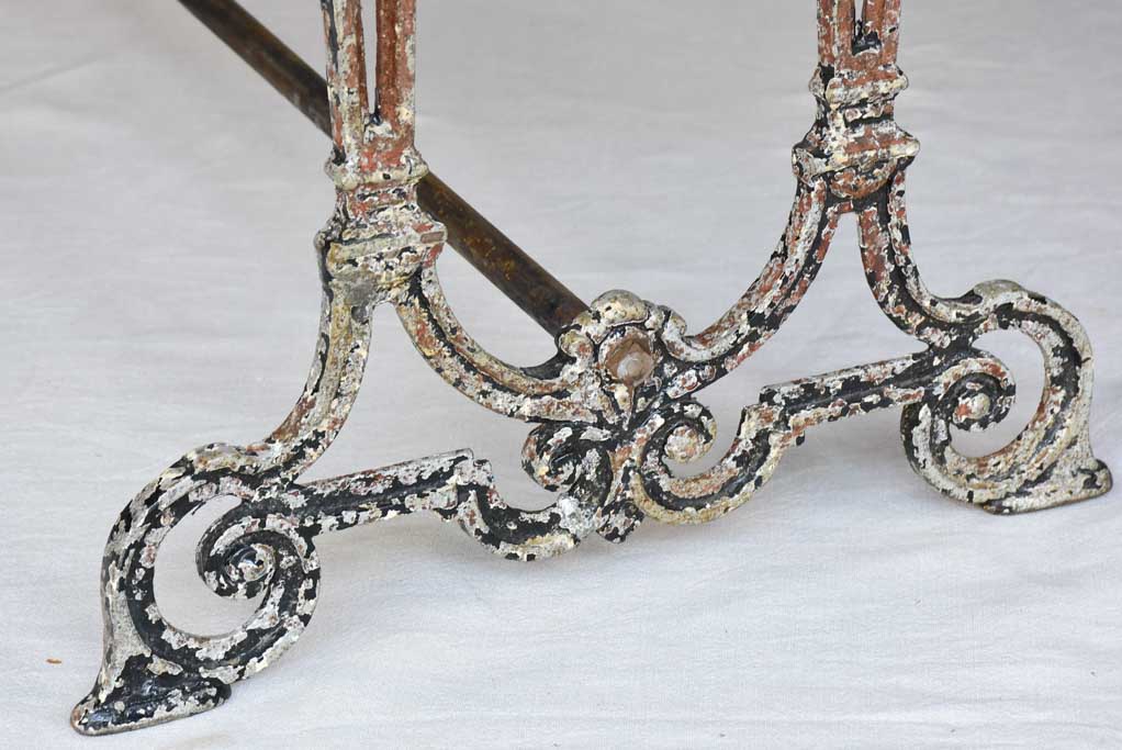 Early twentieth century French bistro table with cast iron base and timber top 66¼"