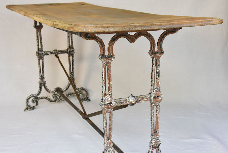 Early twentieth century French bistro table with cast iron base and timber top 66¼"
